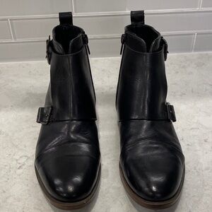 Sleek Black Leather Ankle Boots - straps & zippers
